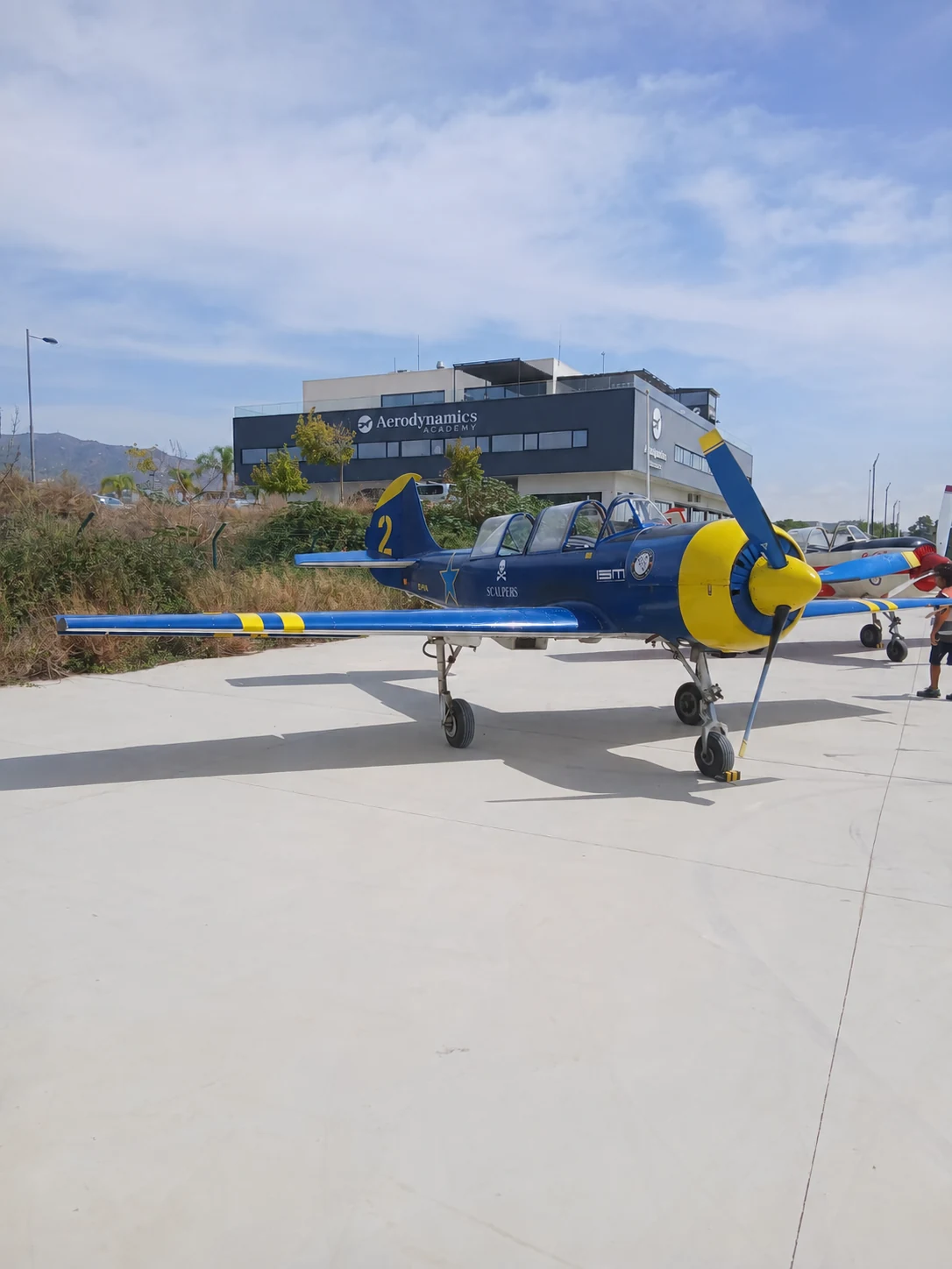 A Yakstars aircraft at La Axarquía, with Aerodynamics Academy in the background.